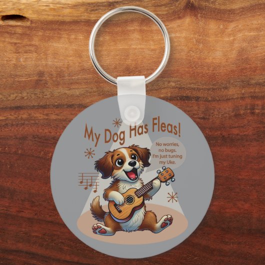うちの犬はフリーズウクレレのチューニング曲を持っている キーホルダー (正面)