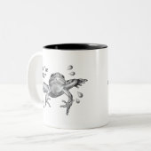 うるう年のベビー: 鉛筆のカエルの跳躍 ツートーンマグカップ (正面左)
