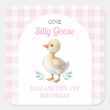 おかしいガチョウのピンクギンガムチェックの女の子の1歳の誕生日