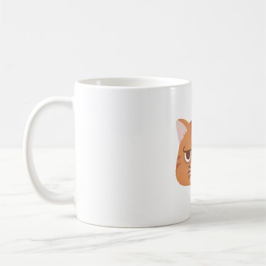 おこった顔のオレンジタビー猫 コーヒーマグカップ (左)