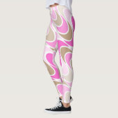 おだてのデザインのピンク及びブラウンの陰 レギンス (左)