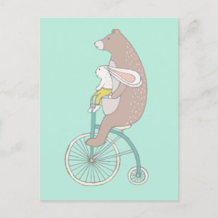 おとぎ話のようなウサギとクマが自転車に乗る ポストカード