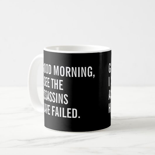 おはようございます暗殺者は失敗したようだね コーヒーマグカップ (正面左)