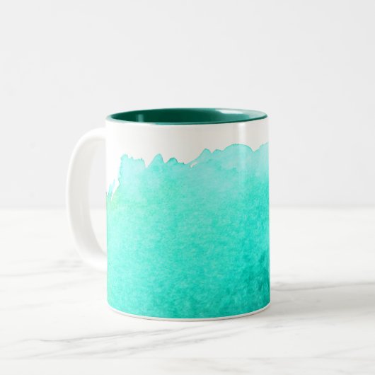 おはようの日光のコーヒー引用文のティール(緑がかった色)の青 ツートーンマグカップ (正面左)