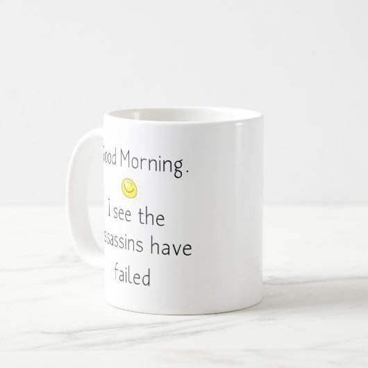 おはよう。暗殺者が失敗したようだ コーヒーマグカップ (正面左)