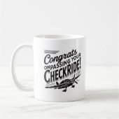 おめでとうのチェックライド通過！ コーヒーマグカップ (左)