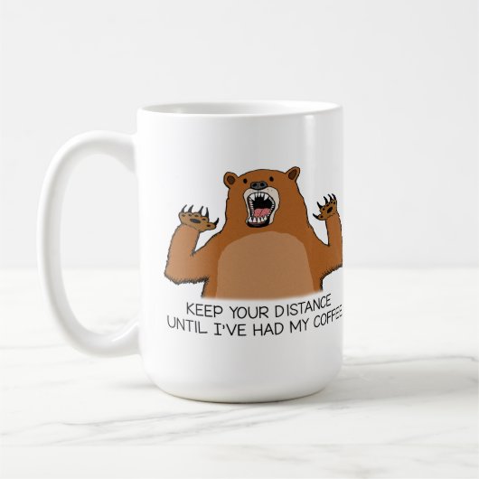 おもしろいなくまはコーヒーの前にどう猛です コーヒーマグカップ (左)