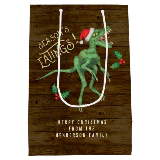 おもしろいなクリスマスのヴェロキラプトルの恐竜のカスタムの文字 ミディアムペーパーバッグ (裏面)