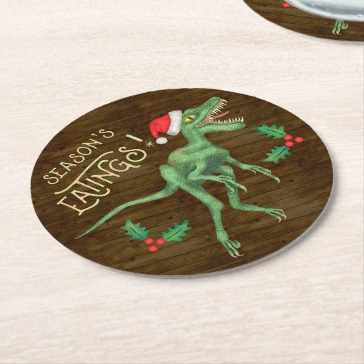 おもしろいなクリスマスのヴェロキラプトルの恐竜の食べ物 ラウンドペーパーコースター (アングル)