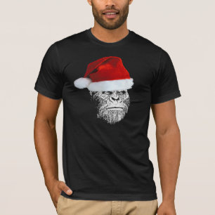 おもしろいなサスカッチのサンタのクリスマスのTシャツ Tシャツ