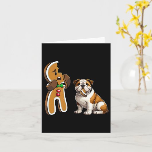おもしろいイギリスブルドッグ犬がジンジャーブレッドをかむ メリー カード (黄色い花)