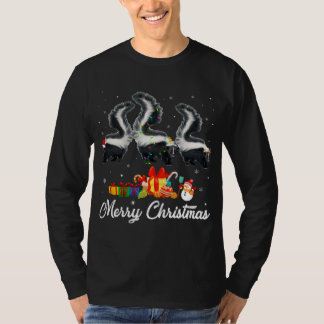 おもしろいクリスマスライトクリスマスパジャマスカンクアニマルL Tシャツ