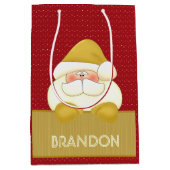 おもしろいレッド&金ゴールドサンタをテーマにした ミディアムペーパーバッグ (正面)