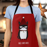 おもしろい猫のカトマスのユーモア エプロン<br><div class="desc">Grochy Catエプロンで調理師の応援おもしろいを準備しよう!クリスマス笑わされるのライトに絡まった猫のイラストレーションをモチーフにした、キッチンで笑える猫好きや楽しむお客様に最適なエプロン。休日のベーキングやフェスティバルの料理に理想的な、それはあなたの休日の集会におもしろいツイストを追加!</div>