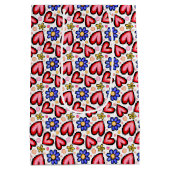 おもしろい赤いハートと紫色の黄色い花 ミディアムペーパーバッグ (裏面)