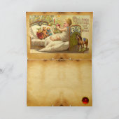 おもちゃとクリスマスプレゼントのあるベッドの子ども シーズンカード (内部)