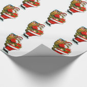 おもちゃのバッグが付いているサンタ ラッピングペーパー (角)
