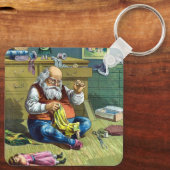 おもちゃの人形を作るサンタクロース、ビンテージクリスマス キーホルダー (裏面)