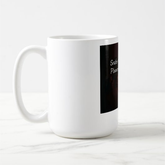 お茶を飲んで笑う コーヒーマグカップ (左)