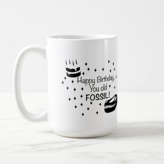 お誕生日おめでとう、化石野郎 コーヒーマグカップ (左)