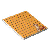 かぼちゃの帽子をかぶった黄色いラブラドールの子犬 ノートパッド (アングル)
