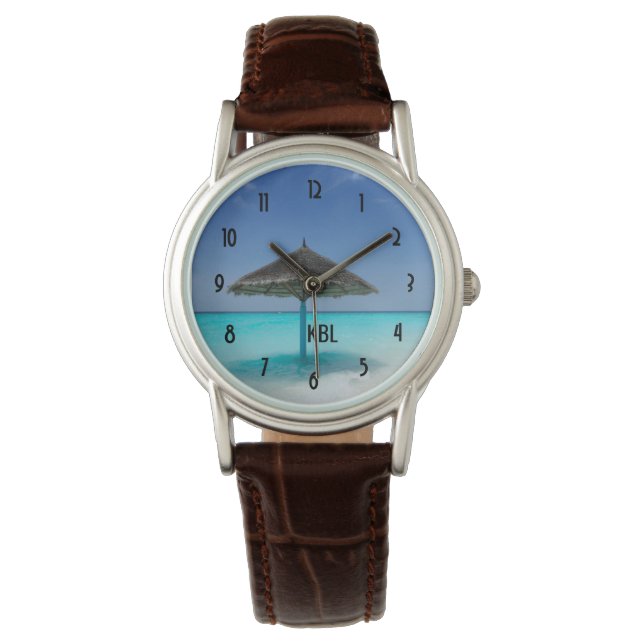 かやぶき傘を持つ風光明媚な熱帯ビーチ 腕時計 (正面)