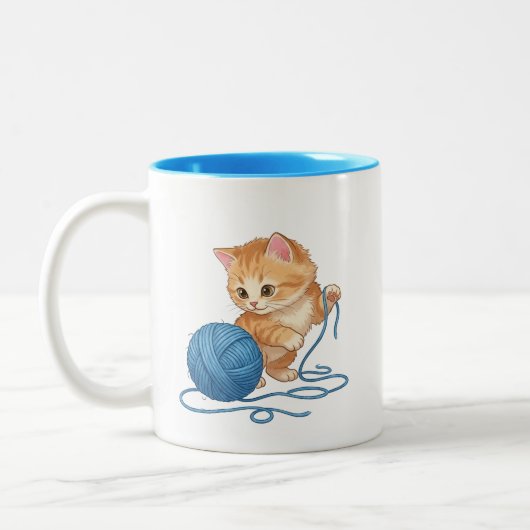 かわいいオレンジの子猫と毛糸の玉のツートン ツートーンマグカップ (左)