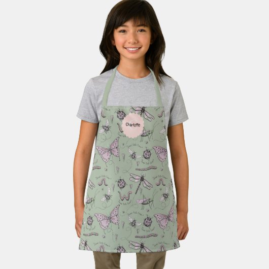 かわいいグリーンとピンクのバグのキッズエプロン エプロン (インサイチュ)