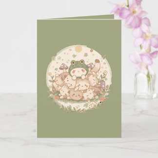 かわいいコテージコアキャットパイルとカエル帽子グリーティング カード