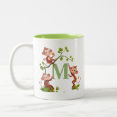 かわいいサル三匹と緑のモノグラムマグ ツートーンマグカップ (左)