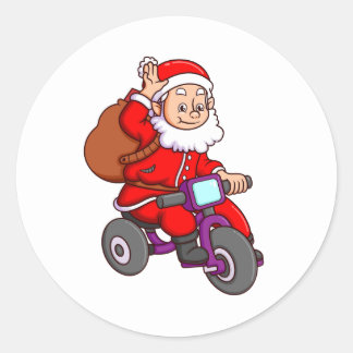 かわいいサンタクロースは自転車と波に乗っている ラウンドシール