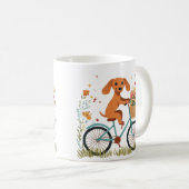かわいいダックスフンドの犬が自転車に乗って春の花を満載したカゴを抱える コーヒーマグカップ (正面右)