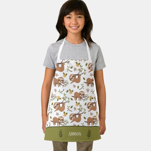 かわいいナマケモノが木の子のパターンキッチンで眠る エプロン (インサイチュ)