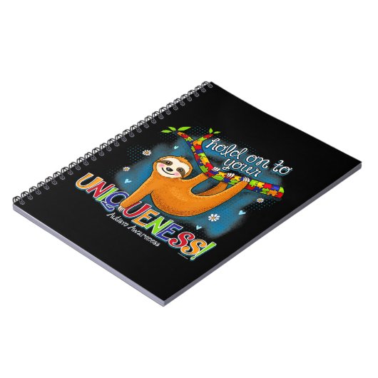 かわいいナマケモノの自閉症の服装は、ユニケにしがみつく ノートブック (左側)