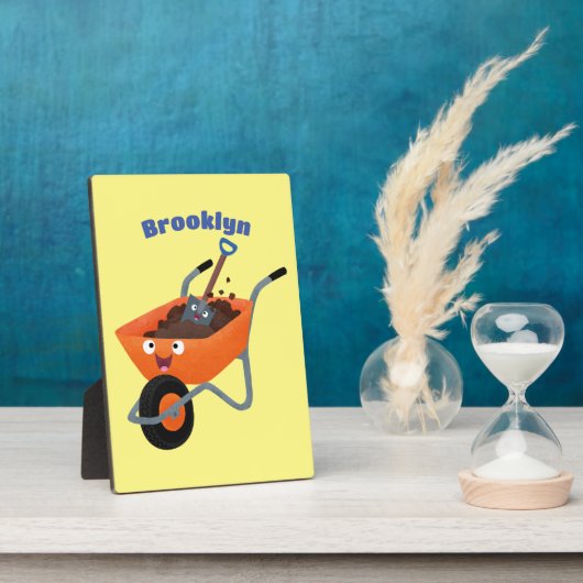 かわいいハッピーオレンジの手押し車のカートゥーンイラストレーション フォトプラーク (側面)