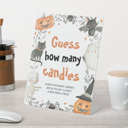 かわいいハロウィーンのカボチャ推測キャンディゲームの数 台座サイン (インサイチュ)