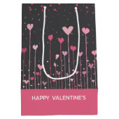 かわいいピンクと赤のバレンタインのハート ミディアムペーパーバッグ (裏面)