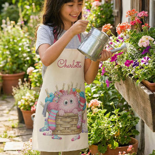 かわいいピンクのふわふわ靴下モンスターの子供向けデザイン エプロン