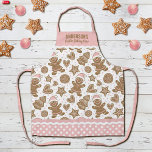 かわいいピンクのクリスマスクッキーベーキングクルー エプロン<br><div class="desc">キュートな休日のジンジャーパンのクッキーのパタ飾ーンこのクリスマスのクッキーのベーキングクルーのエプロン。自分の名前でカスタマイズする。クリスマスおもしろいベーキングだ！エプ縁どロンはピンクと白の水玉模様模様でric racを持つ。クリスマスのおもしろいギフトを作る。Blackberry Boulevardによって設計。</div>