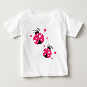 かわいいピンクのLabybirdsおよび花 ベビーTシャツ