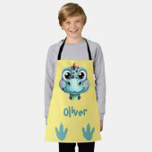 かわいいベビーディノ顔と足跡 エプロン (着用した状態)