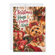 かわいいヨークシャーテリアのクリスマスの抱擁と子犬