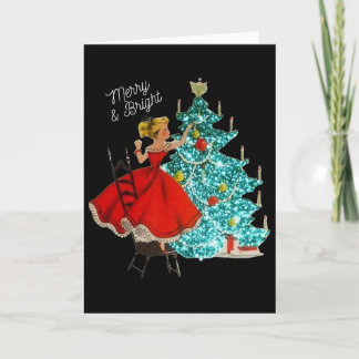 かわいいヴィンテージの明るい女の子がクリスマスツリーを飾っている カード