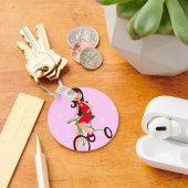 かわいい女の子に乗る三輪車のキャラクター キーホルダー