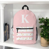 かわいい女の子のピンクストライプのドットと大きなモノグラム プリントバックパック