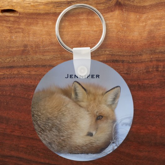 かわいい小さなキツネが冬の写真を丸めた キーホルダー (正面)