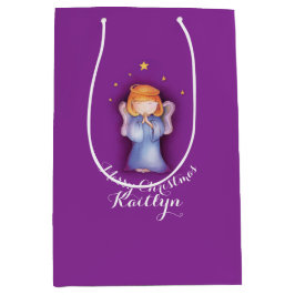 かわいい小さな女の子は芸術によって示されるクリスマスのギフトバッグを祈ります ミディアムペーパーバッグ