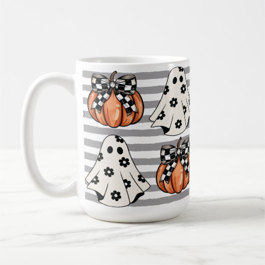 かわいい幽霊と秋のカボチャ コーヒーマグカップ (左)