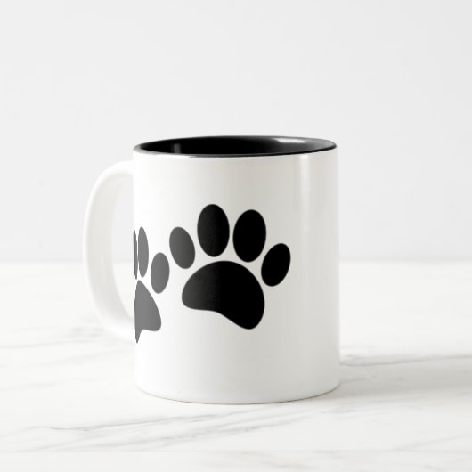 かわいい漫画の黒い子犬の前絵 ツートーンマグカップ (正面左)
