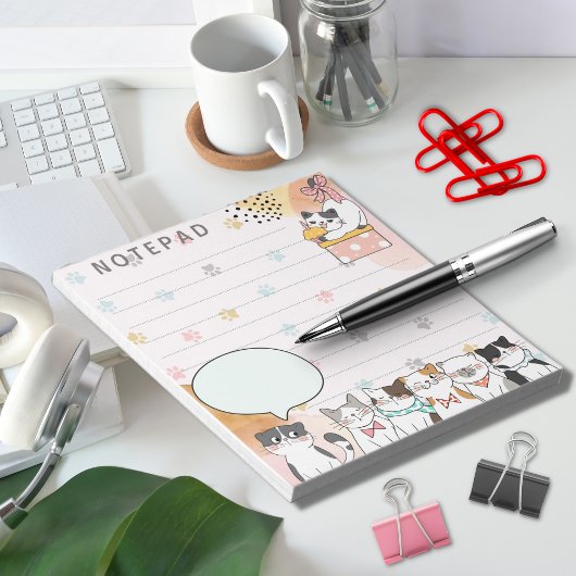 かわいい猫たち – 前足でピンク色の背景 ノートパッド